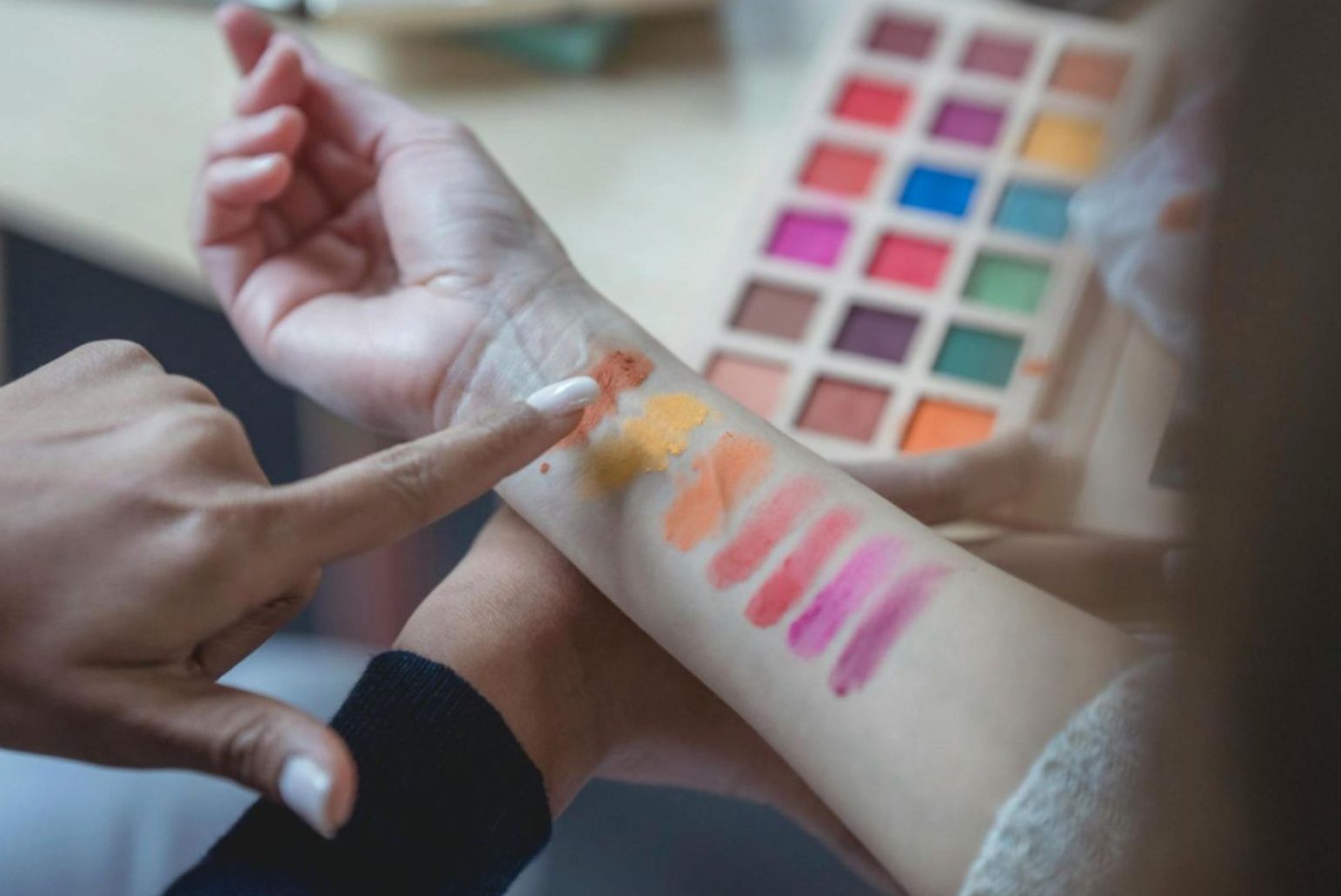Nail technician working in a professional mobile home office manicure setup